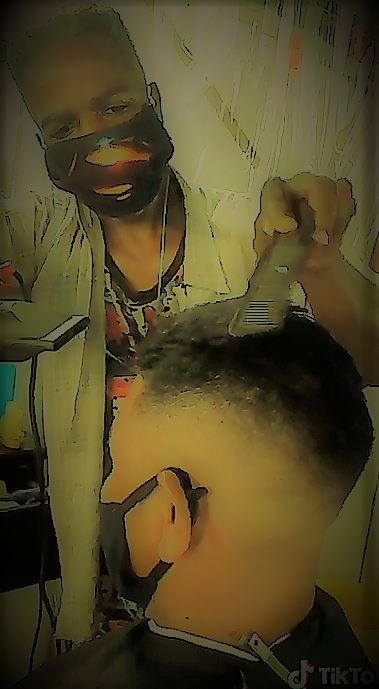 Barber working on hair